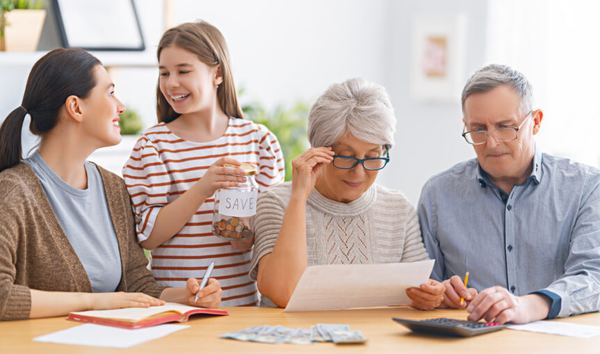 A family reviewing financial documents, symbolizing comprehensive financial security planning with SureWealth.